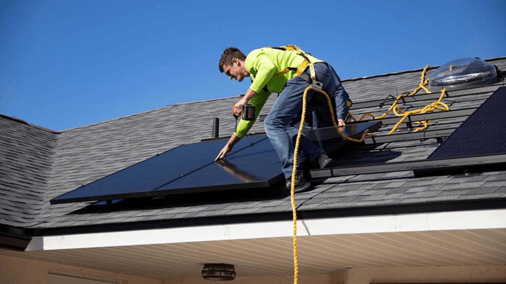 solar installer on roof